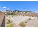 Spacious backyard with pavers, desert landscaping, and privacy wall at 12536 Blissful Sky St, Las Vegas, NV 89138