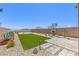 Expansive backyard with artificial turf, desert landscaping, and mountain views at 12536 Blissful Sky St, Las Vegas, NV 89138