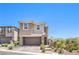 Two-story home with two-car garage, brick driveway, and mountain views at 12536 Blissful Sky St, Las Vegas, NV 89138