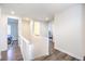 Upstairs hall boasts hardwood floors, natural light, and neutral paint tones, providing a bright and airy atmosphere at 12536 Blissful Sky St, Las Vegas, NV 89138
