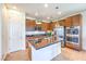Modern kitchen with stainless steel appliances and a center island at 12536 Blissful Sky St, Las Vegas, NV 89138
