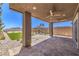 Covered patio featuring ceiling fans and views of the backyard at 12536 Blissful Sky St, Las Vegas, NV 89138