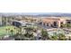 An aerial view showing the resort, parking, pool, and golf course with the city skyline at 135 E Harmon Ave # 1102, Las Vegas, NV 89109