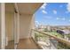 Private balcony with glass railings provides views of the city, golf course, and the landscape at 135 E Harmon Ave # 1102, Las Vegas, NV 89109