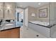 Bathroom showcasing modern fixtures, soaking tub, and glass enclosed shower at 135 E Harmon Ave # 1102, Las Vegas, NV 89109