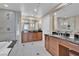 Bathroom featuring a soaking tub, glass shower, and vanity with modern sink at 135 E Harmon Ave # 1102, Las Vegas, NV 89109