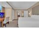 Bright bedroom with a large bed, desk, and a view of the city at 135 E Harmon Ave # 1102, Las Vegas, NV 89109