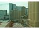 Clear view of surrounding city buildings, roads and rooftops on a sunny day at 135 E Harmon Ave # 1102, Las Vegas, NV 89109