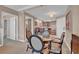 Dining area with modern table, view to kitchen, and well-lit ambiance at 135 E Harmon Ave # 1102, Las Vegas, NV 89109