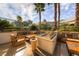 Outdoor fire pit area with comfortable seating and lush landscaping at 135 E Harmon Ave # 1102, Las Vegas, NV 89109