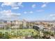 Expansive golf course view with palm trees and city skyline under a beautiful blue sky at 135 E Harmon Ave # 1102, Las Vegas, NV 89109