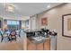Modern kitchen features custom cabinetry, black countertops, and stainless steel appliances at 135 E Harmon Ave # 1102, Las Vegas, NV 89109