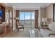 Bright living room showcasing built-in storage, neutral decor, and panoramic city views at 135 E Harmon Ave # 1102, Las Vegas, NV 89109