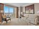 Relaxing living room offers a comfy sofa, city views, and a private balcony access at 135 E Harmon Ave # 1102, Las Vegas, NV 89109