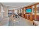 Stylish living room with a dining table, built-in entertainment center, and neutral decor at 135 E Harmon Ave # 1102, Las Vegas, NV 89109
