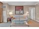 Living room with a plush sofa, glass coffee table, and sophisticated decor at 135 E Harmon Ave # 1102, Las Vegas, NV 89109