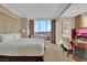 A bright main bedroom with a large window and a work desk at 135 E Harmon Ave # 1102, Las Vegas, NV 89109