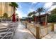 Relaxing pool area featuring private cabanas, lounge chairs, and palm trees at 135 E Harmon Ave # 1102, Las Vegas, NV 89109