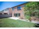 The backyard has artificial grass, a concrete patio, and an easy access sliding glass door at 1405 Gilbert Creek Ave, North Las Vegas, NV 89031