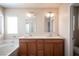Bathroom featuring dual sinks, tub, and modern fixtures at 1405 Gilbert Creek Ave, North Las Vegas, NV 89031