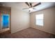 Cozy bedroom with neutral walls, carpet flooring, and a ceiling fan for added comfort at 1405 Gilbert Creek Ave, North Las Vegas, NV 89031