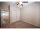 Bedroom features carpet floors, closet, ceiling fan, and neutral colors at 1405 Gilbert Creek Ave, North Las Vegas, NV 89031