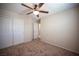 Bedroom featuring neutral walls, carpet flooring, closet, and ceiling fan at 1405 Gilbert Creek Ave, North Las Vegas, NV 89031