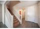 An entryway features tile floors leading to a carpeted staircase and rooms at 1405 Gilbert Creek Ave, North Las Vegas, NV 89031