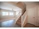 Inviting entryway with a staircase, neutral paint, and tile flooring at 1405 Gilbert Creek Ave, North Las Vegas, NV 89031