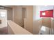 Hallway with a staircase and neutral colors at 1405 Gilbert Creek Ave, North Las Vegas, NV 89031
