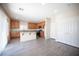 Spacious kitchen with a granite countertops, stainless steel appliances and tile flooring at 1405 Gilbert Creek Ave, North Las Vegas, NV 89031