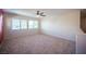 Loft with neutral paint, three windows, and carpeted floors at 1405 Gilbert Creek Ave, North Las Vegas, NV 89031