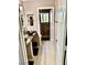 A stylish bathroom with a vessel sink, granite countertop, and tiled floors at 1915 Hazeltine Ct, Henderson, NV 89074
