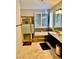 Bright bathroom with double vanity, soaking tub, and separate glass shower at 1915 Hazeltine Ct, Henderson, NV 89074