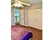 Bedroom showcasing closet and a view of the stairway with a metal railing at 1915 Hazeltine Ct, Henderson, NV 89074