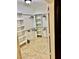 Walk-in closet with built-in shelving and tile flooring at 1915 Hazeltine Ct, Henderson, NV 89074