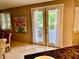 A bright dining room with doors leading to an outdoor patio at 1915 Hazeltine Ct, Henderson, NV 89074