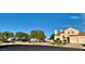 This two-story home has desert landscaping, a terracotta roof, and a two-car garage set on a cul-de-sac at 1915 Hazeltine Ct, Henderson, NV 89074