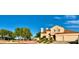 This charming home sits on a corner lot and features desert landscaping, a terracotta roof, and a two-car garage at 1915 Hazeltine Ct, Henderson, NV 89074