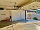 Spacious garage with built-in storage cabinets, open door, and view of backyard at 1915 Hazeltine Ct, Henderson, NV 89074