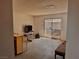 View of the empty living room with sliding glass doors to the backyard at 212 Hinkle St, Las Vegas, NV 89107