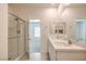 Bright bathroom featuring a double sink vanity and glass-enclosed shower at 219 Cordelia Cove Ave # 513, Henderson, NV 89011