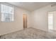 Bright carpeted bedroom featuring an adjacent bathroom and an additional room at 219 Cordelia Cove Ave # 513, Henderson, NV 89011
