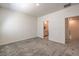 Bright bedroom with carpet, features adjoining bathroom and hallway access at 219 Cordelia Cove Ave # 513, Henderson, NV 89011