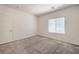 Well-lit carpeted bedroom with a window and closet door at 219 Cordelia Cove Ave # 513, Henderson, NV 89011