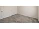 Simple bedroom with gray carpeting, white walls, and a double-door closet for storage at 219 Cordelia Cove Ave # 513, Henderson, NV 89011