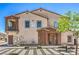 Two story townhome with desert landscaping, open porch, and two front doors at 219 Cordelia Cove Ave # 513, Henderson, NV 89011