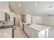 Spacious kitchen featuring an island, modern appliances, and open access to other rooms at 219 Cordelia Cove Ave # 513, Henderson, NV 89011