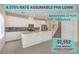Bright kitchen boasts an island, stainless appliances, and a modern backsplash at 219 Cordelia Cove Ave # 513, Henderson, NV 89011