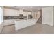 Bright kitchen with an island, stainless appliances, and access to the second floor at 219 Cordelia Cove Ave # 513, Henderson, NV 89011